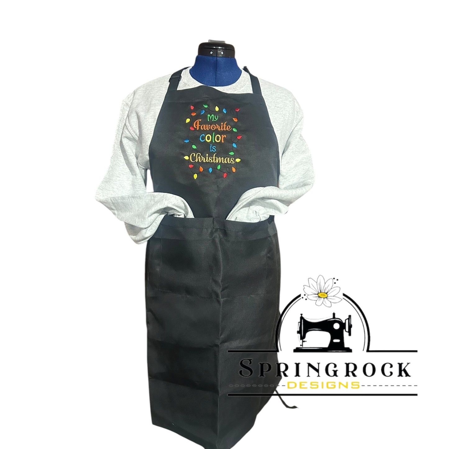 Black apron with colorful text on a mannequin, branded with Springrock Designs.
